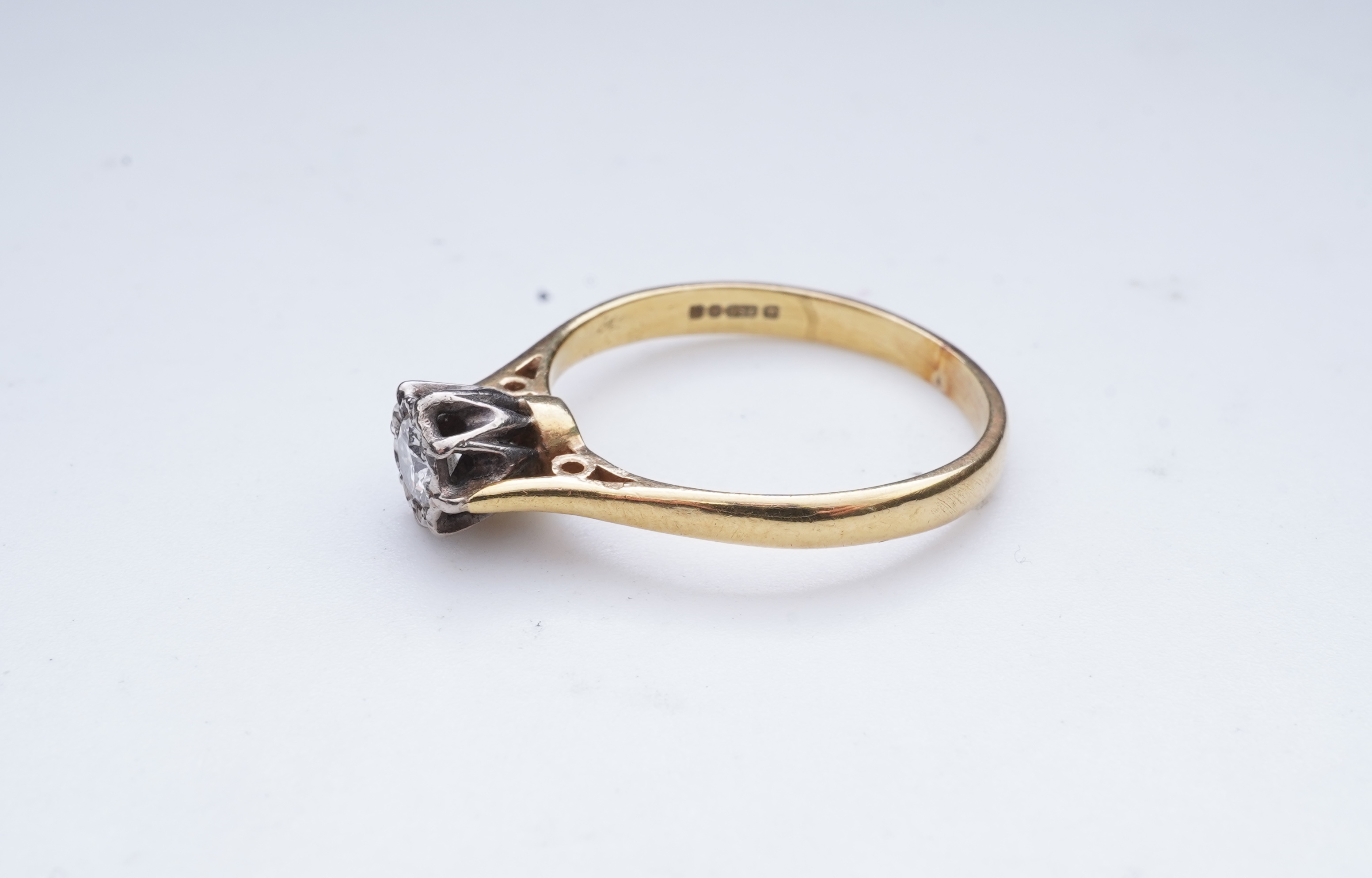 A diamond solitaire ring